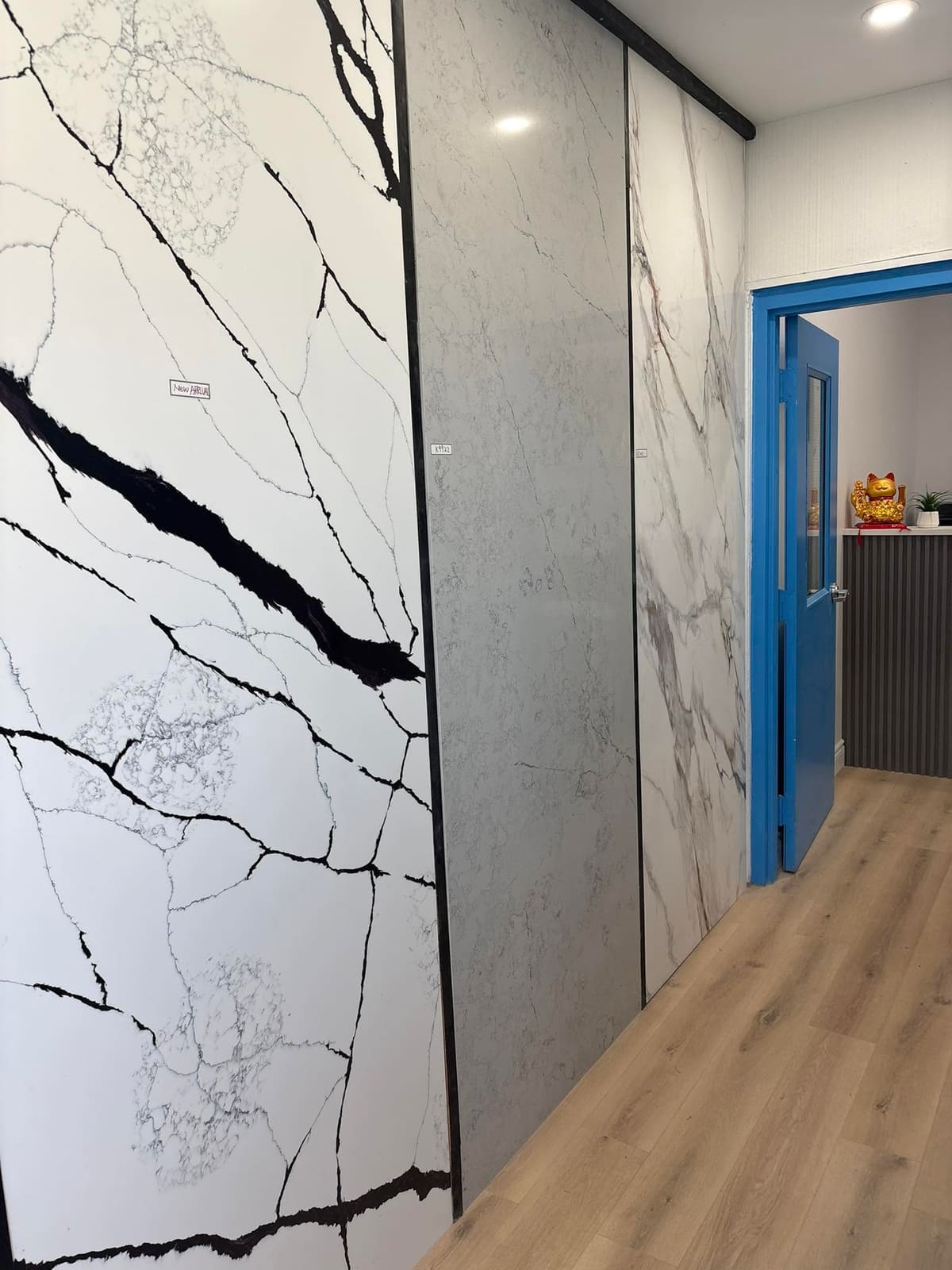 Dramatic black-veined porcelain feature wall running floor to ceiling