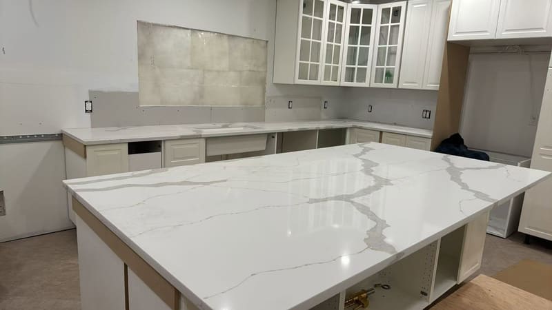 Undermount sink cut into a polished quartz island